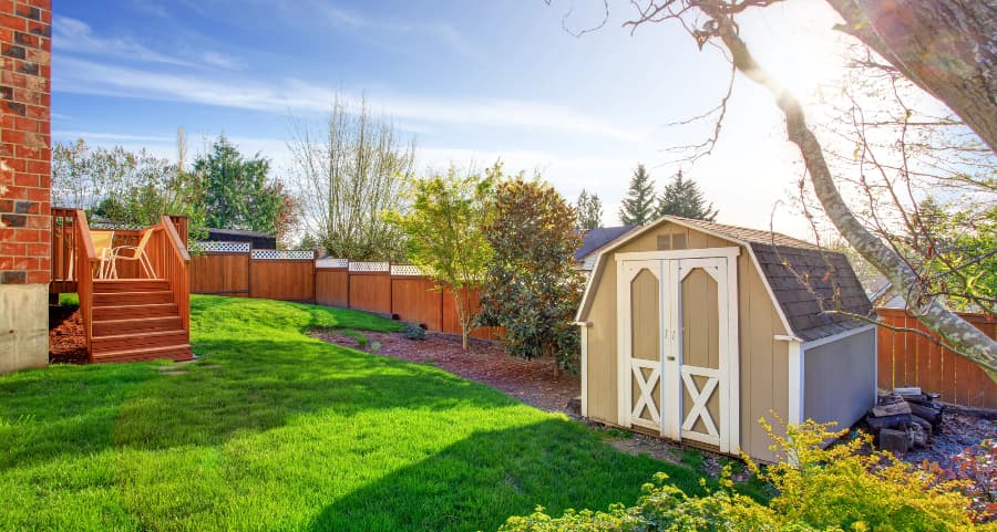 Fenced backyard with storage shed in Bozeman